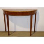 Walnut veneered and satinwood demi - lune side table raised on tapered legs with spade feet in the