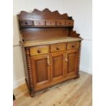 19th C. pine Scottish kitchen dresser with gallery back and three doors over three blind drawers. {