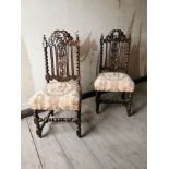 Pair of carved oak hall chairs with upholstered seats { 107cm H X 49cm W X 45cm D }.
