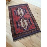 Persian100% wool hand knotted rug { 144cm L X 86cm W }.