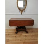 19th C. mahogany double drop leaf side table raised on bulbous column four outswept legs and lion'