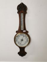 19th. C. carved oak Aneroid barometer{ 83cm H X 26cm W }.