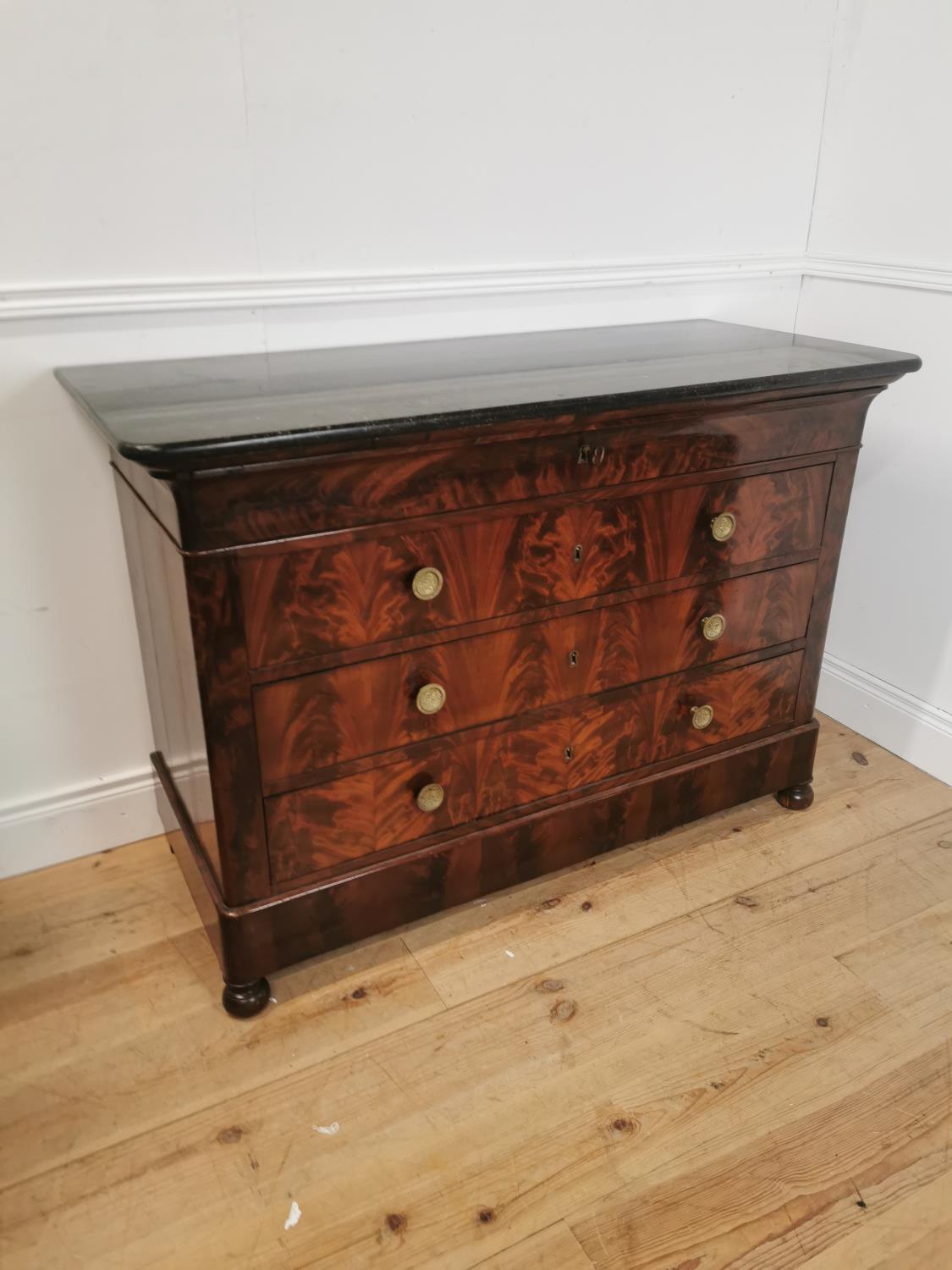 19th. C. flamed mahogany chest the marble top above four long drawers raised on bun feet { 90cm H