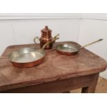 Two copper and brass pans and a teapot