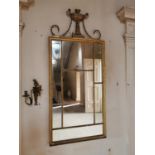 Regency giltwood pier mirror decorated with swags and urn {153 cm H x 68 cm W}.