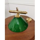 Brass hanging light with green glass shade { 60cm H X30cm W }.