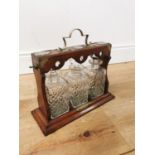 Edwardian oak tantalus with silverplated mounts three cut glass bottles and original key { 33cm H