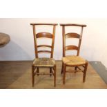 Pair of early 20th. C. oak ladder backed chairs with rush seating { 98cm H X 38cm W X 34cm D }.