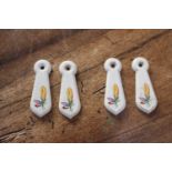 Two pairs of ceramic keyhole covers { 7cm H X 2cm W }.