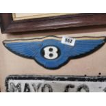 B cast iron sign. {13 cm H x 39 cm W}.