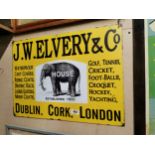J W Elvery Dublin Cork and London tin plate advertising sign. {50 cm H x 70 cm W}.