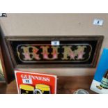 Reverse painted glass Rum framed advertising sign. {25 cm H x 55 cm W}.