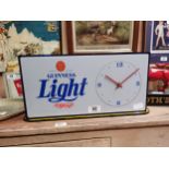 Guinness Light up advertising clock. {23 cm H x 46 cm W}.