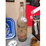 Large Bell's Whiskey advertising bottle. {53 cm H x 16 cm Dia}