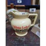 Dewar’s White Label whiskey ceramic water jug. {13 cm H x 16 cm W x 12 cm D}