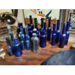 Collection of 24 19th C. blue poison and castor oil bottles.