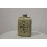 Gibney's Imperial Hotel Galway stoneware bottle. {26 cm H x 7 cm W}