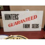 Hunters’ Guaranteed Farm Seeds cardboard advertisement. { 32 cm H x 60 cm W}.