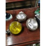 Three 1960’s metal spot lamps for cars.