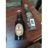 Two wooden Guinness bottles in the form of brushes. {20 cm H x 6 cm W}.