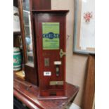 Early 20th C. mahogany Richmond Gem cigarette dispensing machine. {57 cm H x 52 cm W x 22 cm D}.