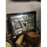 Guinness framed advertising mirror. {37 cm H x 47 cm W}.