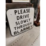 Alloy sign – Please Drive Slowly Through Blarney. {92 cm H x 62 cm W}.