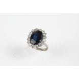 White gold ring with diamonds and sapphire