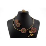 Yellow gold set with rubies and emeralds
