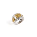 White gold ring with fancy yellow diamonds and natural diamonds