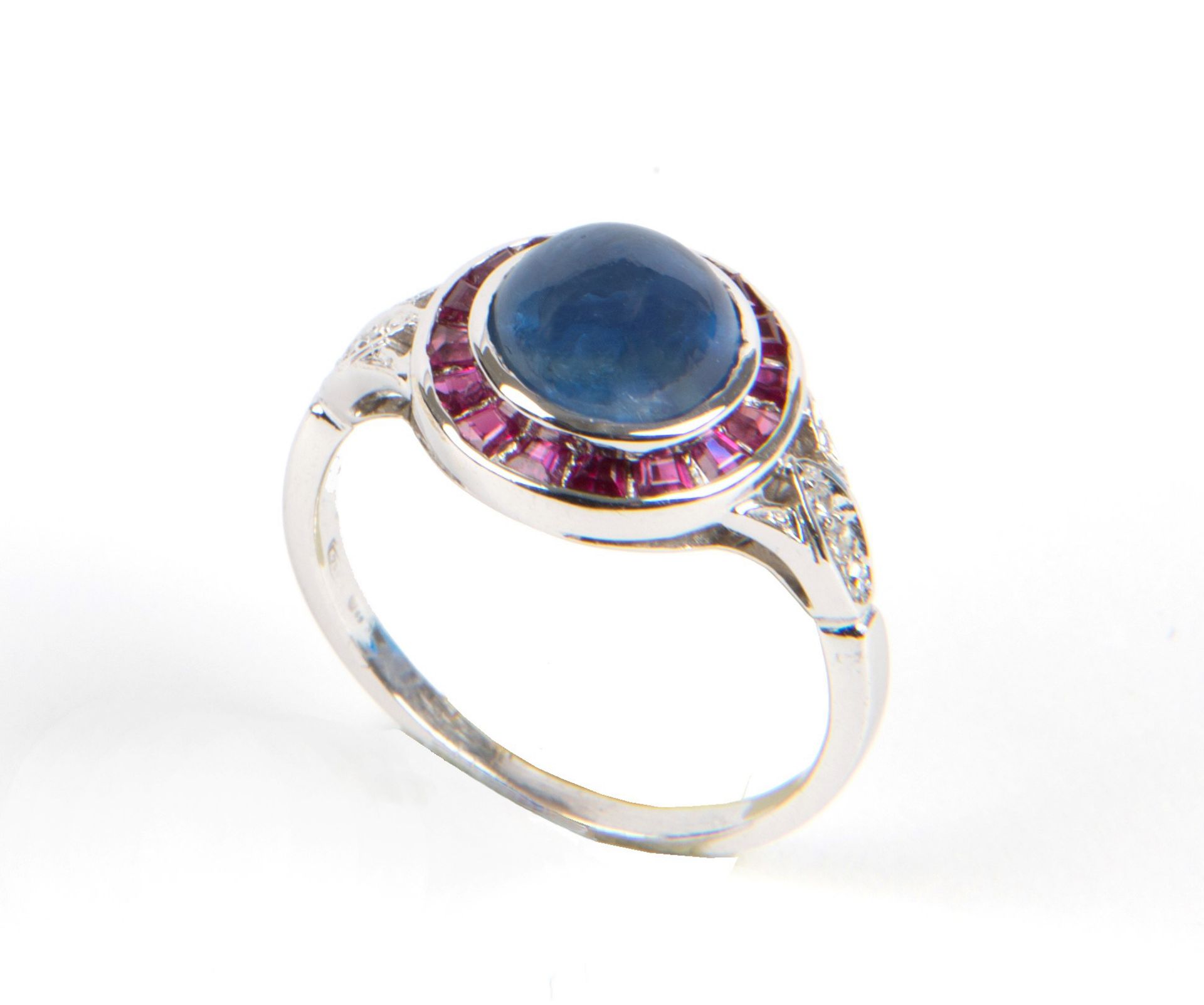 White gold ring with diamonds, rubies and sapphires