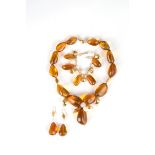 Set in gold, amber and pearls