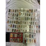 ALBUM OF MIXED COLLECTIBLE CARDS INCLUDING TEA, CIGARETTE,