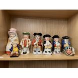 SHELF OF CERAMIC TOBY JUGS SOME WITH LIDS INCLUDING ROYAL DOULTON THE FALCONER