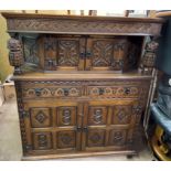 OAK JACOBEAN REVIVAL CARVED CLOSED/COURT CUPBOARD (PLEASE NOTE THERE IS NO BACK TO THIS PIECE)