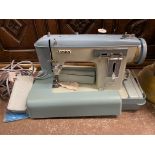 JONES CASED ELECTRIC SEWING MACHINE WITH TREADLE