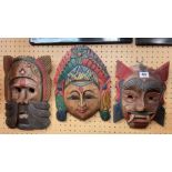 THREE EASTERN WOODEN WALL MASKS