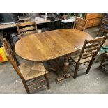 OAK DROP FLAP DINING TABLE AND FOUR RAFFIA STRUNG LADDERBACK CHAIRS