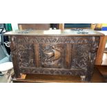 OAK THREE PANEL COFFER CARVED WITH NAUTICAL THEMES WITH TUDOR ROSE SIDE PANELS