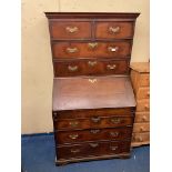 MID 18TH CENTURY OAK BUREAU CHEST WITH A FITTED STEPPED INTERIOR