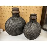 PAIR OF CARVED WOODEN INDIAN MATKA POTS AND COVERS WITH IRON JAALI CHAIN WORK JACKETS