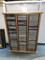 PINE CD STORAGE RACK CONTAINING CLASSICAL CDS