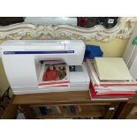 HUSQVARNA VIKING ELECTRIC SEWING MACHINE WITH PATTERN BOOKS AND TEAK EFFECT SEWING CABINET OF