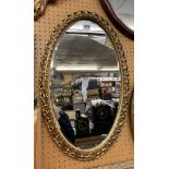 OVAL GILT SCROLL FRAMED MIRROR