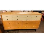 MID 1950S G PLAN TEN DRAWER "CHINA WHITE" SIDEBOARD COMPRISED OF BLONDE OAK AND WHITE LACQUER ON