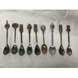 SMALL BAG OF SILVER AND WHITE METAL SOUVENIR TEASPOONS