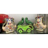 NOVELTY GREEN RACING CAR TEAPOT AND PAIR OF PARAKEET FIGURES AND GERMAN FLORAL ENCRUSTED VASES