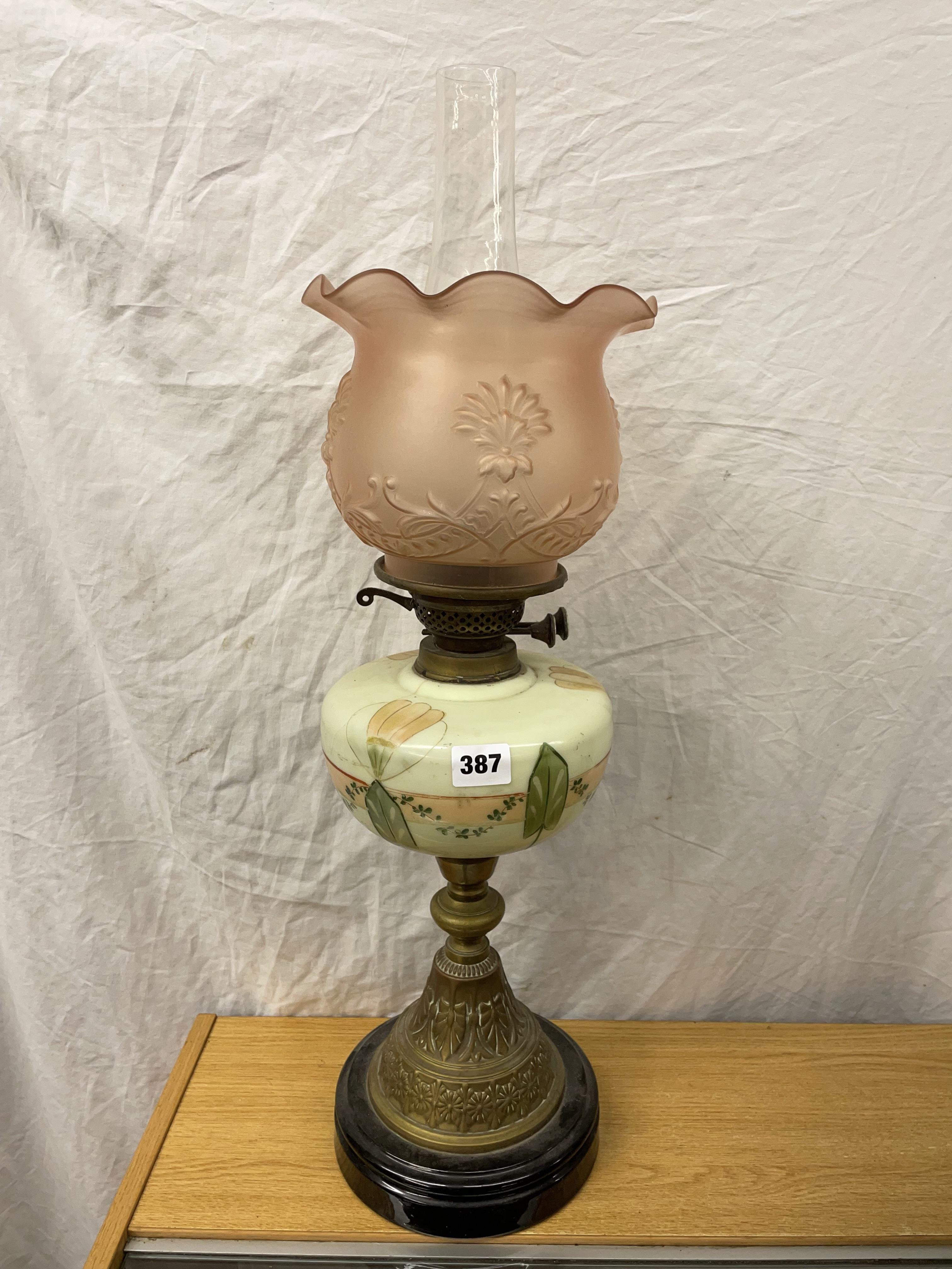 VICTORIAN OIL LAMP WITH PAINTED OPAQUE RESERVOIR AND PEACH TINTED FLORAL CRIMPED SHADE