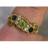 18CT GOLD PERIDOT AND DIAMOND CROSSOVER RING SIZE H