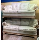 PAIR OF ITALIAN CREAM STITCHED LEATHER AND WOODEN SHOW FRAME SOFAS